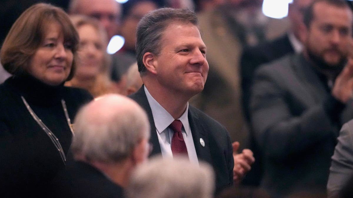 Former N.H. Gov. Chris Sununu is recognized by Republican Kelly Ayotte during her inauguration at the State House, Thursday, Jan. 9, 2025, in Concord, N.H.