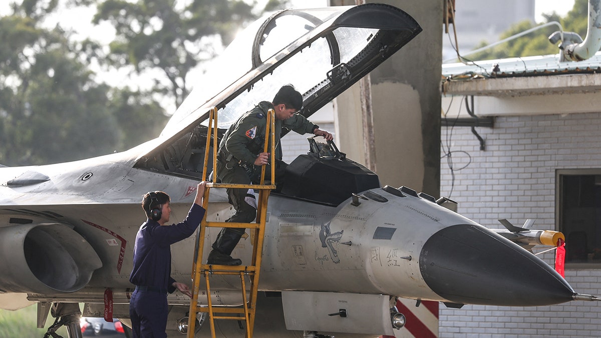 Taiwan Air Force pilot climbs into Indigenous Defense Fighter aircraft