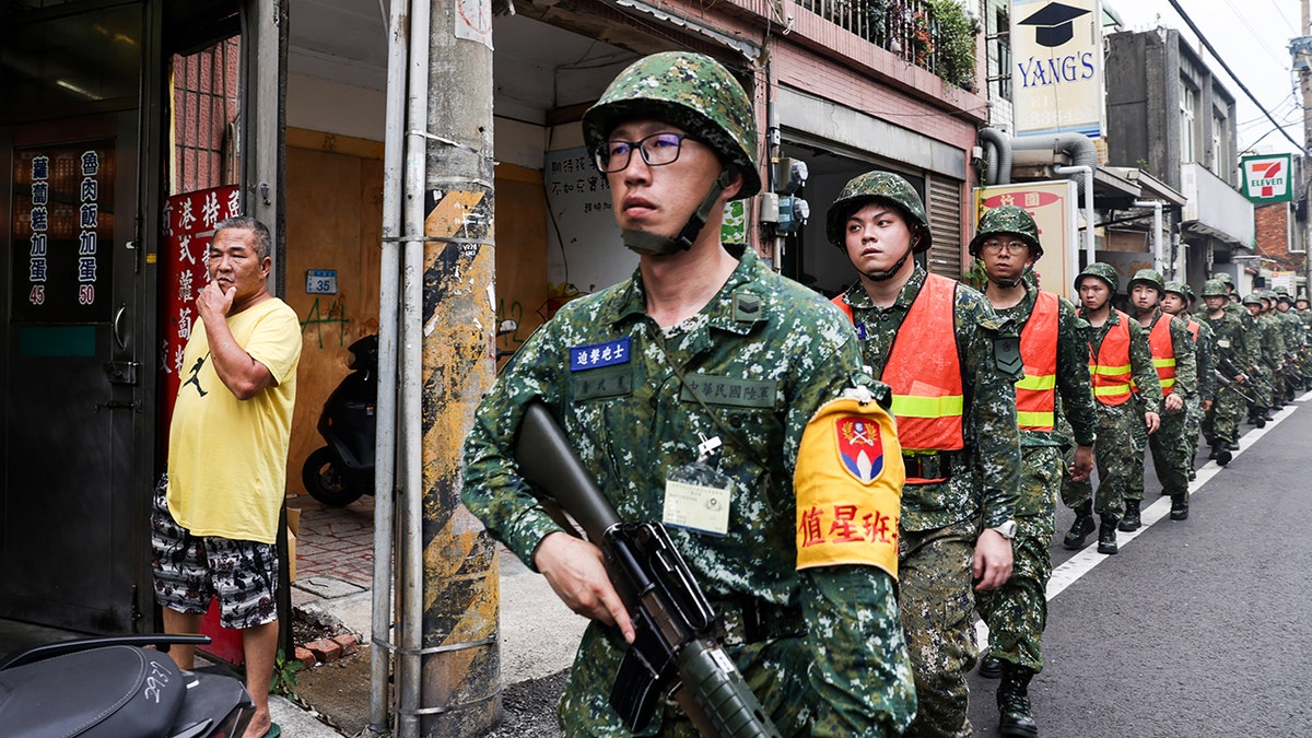 Soldiers march along a street during the Han Kuang military exercise in Taoyuan, Taiwan, on Wednesday, July 26, 2023.