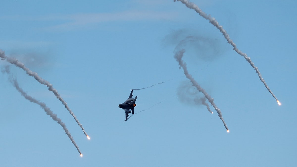 An RF-16 fighter jet drops flares during the live-fire Han Kuang military exercise, which simulates China's People's Liberation Army invading the island, in Pingtung, Taiwan, on May 30, 2019.