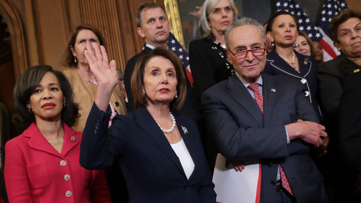 (L-R) Rep. Lisa Blunt Rochester, D-Del., Rep. Nancy Pelosi, D-Calif., Sen. Chuck Schumer, D-N.Y., and other congressional Democrats hold a rally and news conference ahead of a House vote on health care and prescription drug legislation in the Rayburn Room at the U.S. Capitol on May 15, 2019 in Washington, D.C.