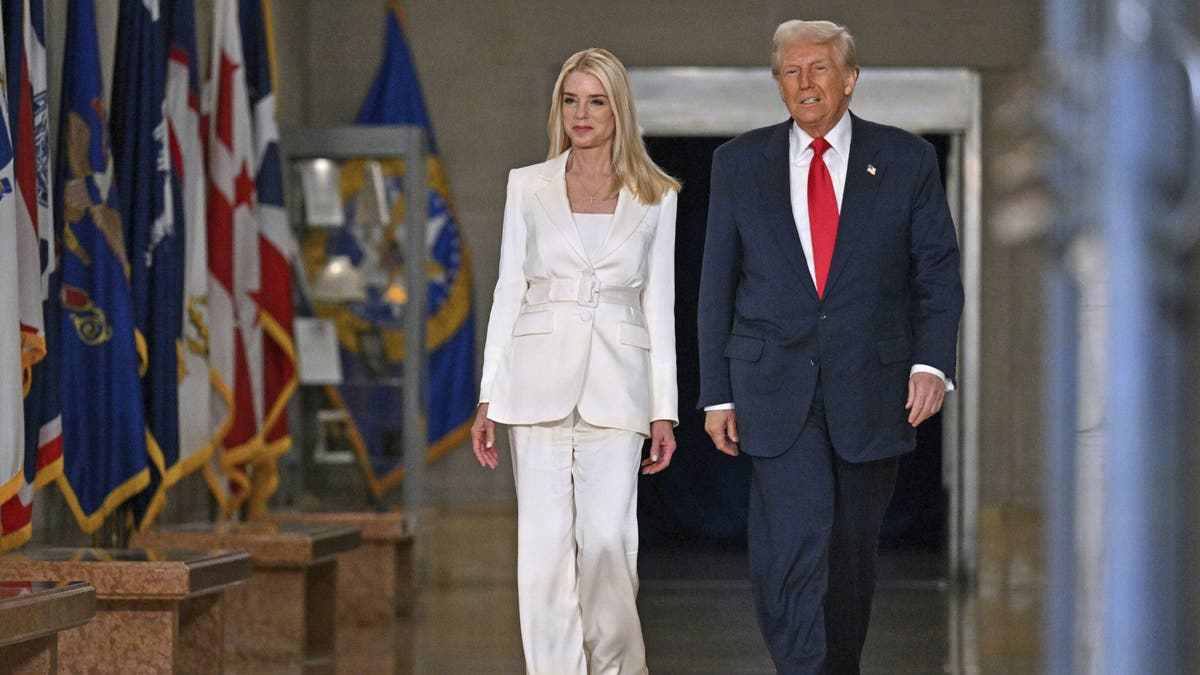 President Donald Trump arrives with Attorney General Pam Bondi at the Justice Department ahead of Trump's address March 14, 2025. 