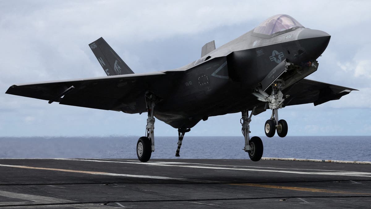 A F-35 jet lands on the USS Carl Vinson aircraft carrier during the Rim of the Pacific (RIMPAC) military exercises about 100 miles south of Oahu, Hawaii, U.S. July 19, 2024.