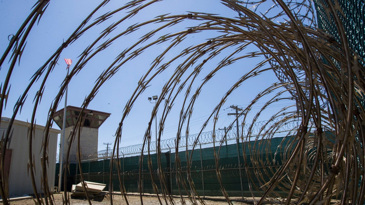 A view through razor wire of the migrant detention camp at Guantanamo Bay