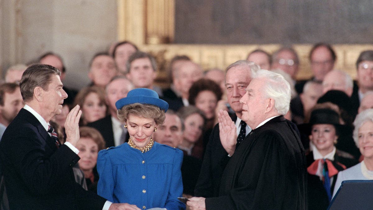 Reagan, left, beside his wife, Nancy Reagan, is sworn in as the 40th President of the United States by Chief Justice Warren Burger during the inaugural ceremony in the Capitol Rotunda in Washington, D.C., on Jan. 21, 1985.