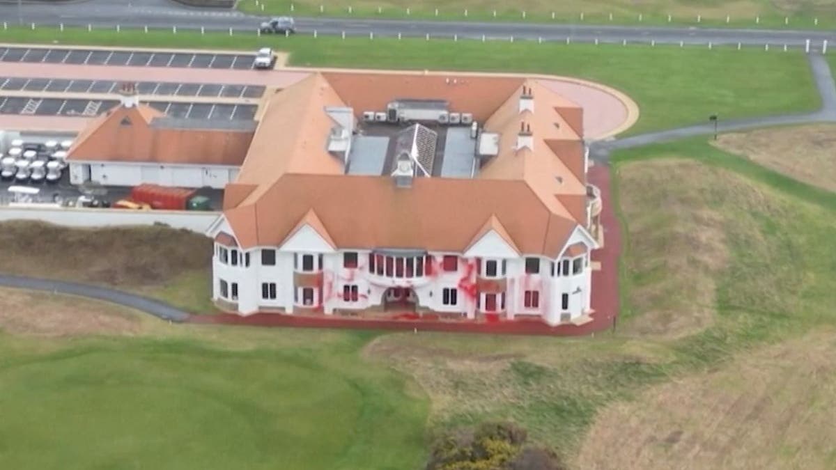 Drone footage shows Trump's Turnberry resort clubhouse splattered with red paint.