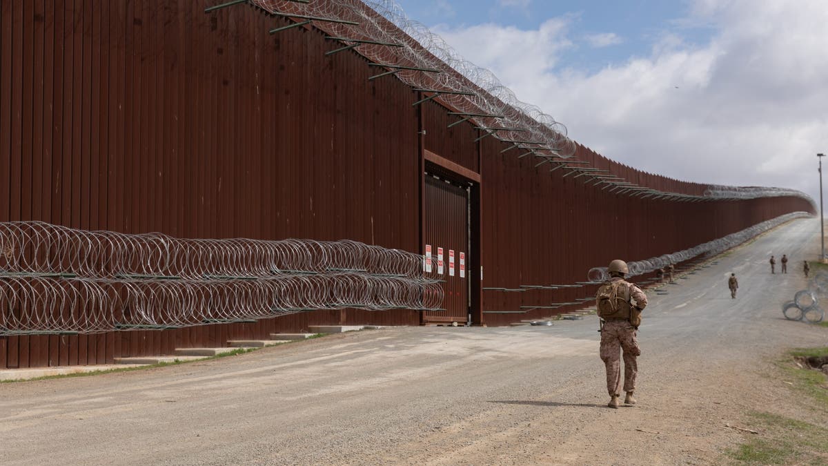 Marines along border wall