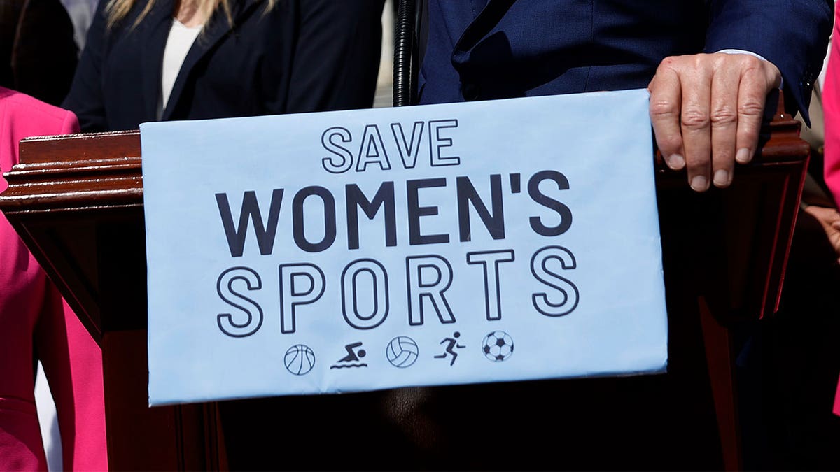 Save Women's Sports sign held at the US Capitol