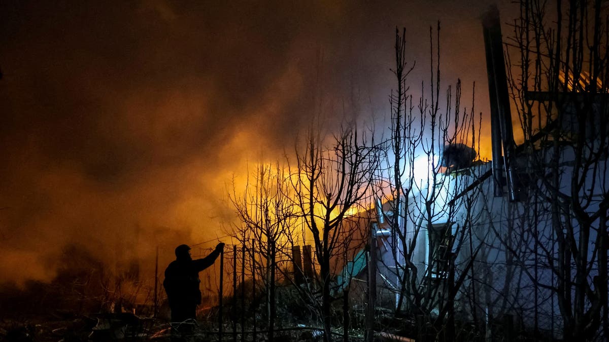 Rescuers work at the site of a building destroyed during a Russian air strike, amid Russia's attack on Ukraine, in Kherson, Ukraine March 14, 2025.