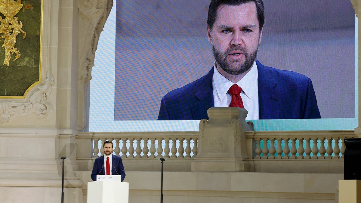 JD vance speaks at podium at paris AI summit