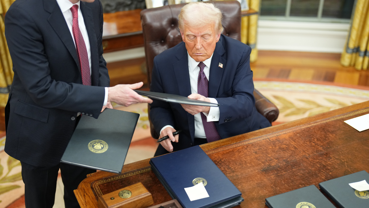 Trump signing executive orders in the White House