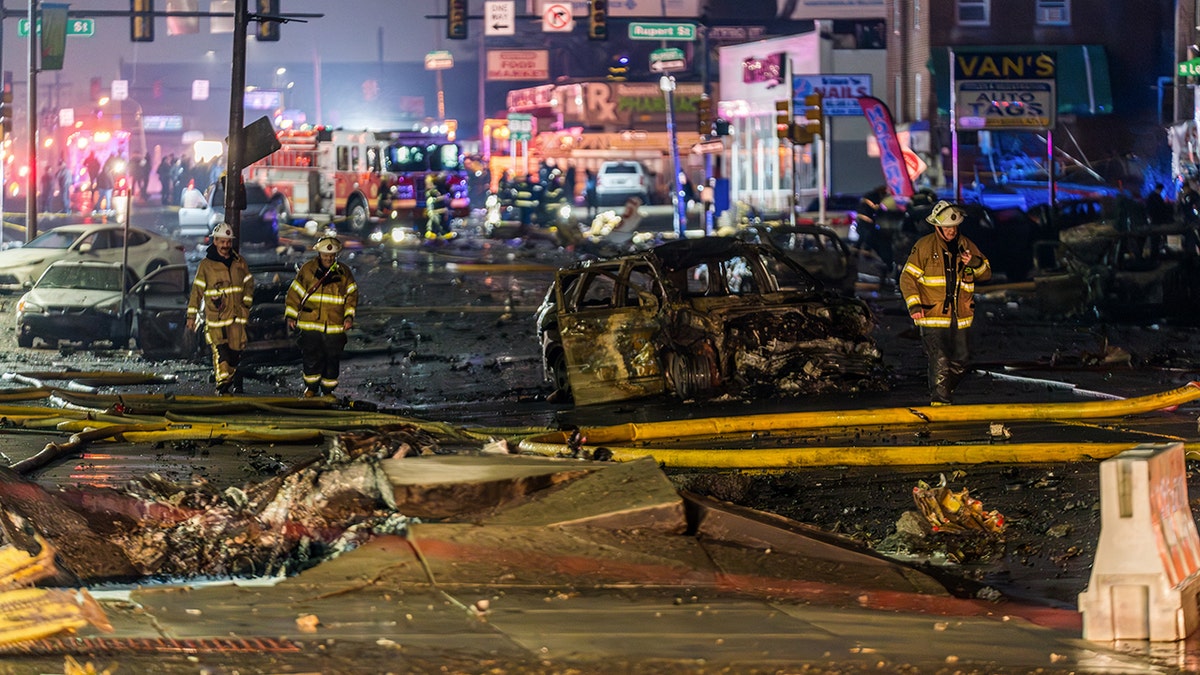 Firefighters on the scene of the deadly plane crash in Philadelphia