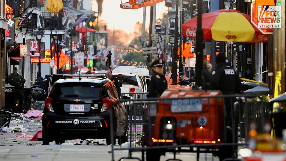 Police investigate a crime scene on Bourbon Street in New Orleans, Louisiana