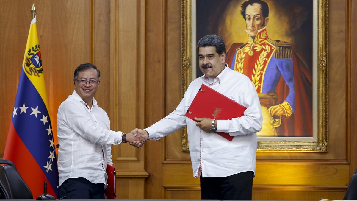 Colombian President Gustavo Petro, left, and his Venezuelan counterpart, Nicolás Maduro, shake hands after signing agreements at the Miraflores presidential palace in Caracas, Venezuela, on Nov. 2, 2022.