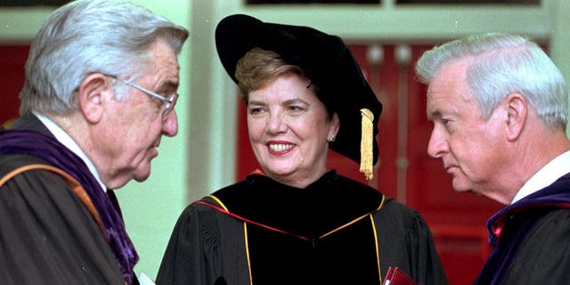 The system president of the University of North Carolina, Molly Broad, center, speaks with former presidents, William Friday, left, and Gov. Jim Hunt, right, on April 29, 1998, in Raleigh, North Carolina.