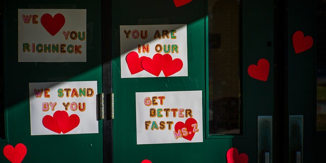 Messages of support for teacher Abby Zwerner, who was shot by a 6-year-old student, grace the front door of Richneck Elementary School Newport News, Virginia. on Monday Jan. 9, 2023. The Virginia teacher who authorities say was shot by a 6-year-old student is known as a hard-working educator who is devoted to her students and enthusiastic about the profession that runs in her family.