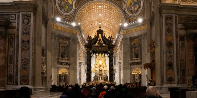 Mourners enter St. Peter's Basilica where the body of Pope Emeritus Benedict XVI lies in state inside at The Vatican, Wednesday, Jan. 4, 2023.