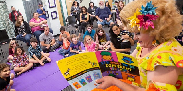 Rich Kuntz, also known as Gidget, reads to children during Drag Queen Story Hour on March 21, 2019. The LGBT+ Center Orlando canceled a weekend drag queen story hour for children after receiving online threats.  