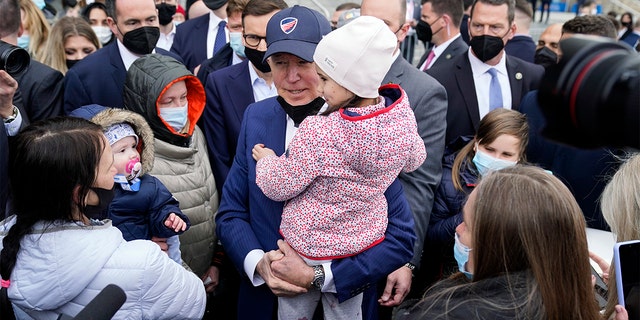 President Biden meets with Ukrainian refugees and humanitarian aid workers during a visit to PGE Narodowy Stadium, Saturday, March 26, 2022, in Warsaw. 