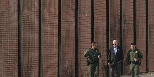 President Joe Biden walks with U.S. Border Patrol agents along a stretch of the U.S.-Mexico border in El Paso, Texas, Sunday, Jan. 8, 2023.