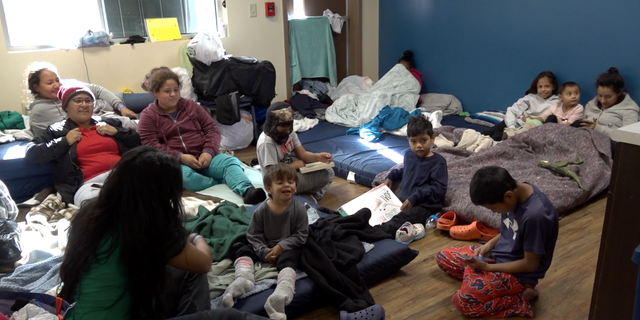 Migrant women and children in a shared room at Rescue Mission of El Paso.