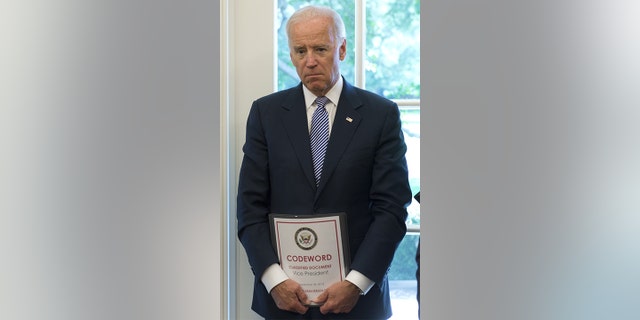 Vice President Joe Biden attends a meeting between President Obama and Israeli Prime Minister Benjamin Netanyahu in the Oval Office of the White House in Washington, D.C., Sept. 30, 2013. 