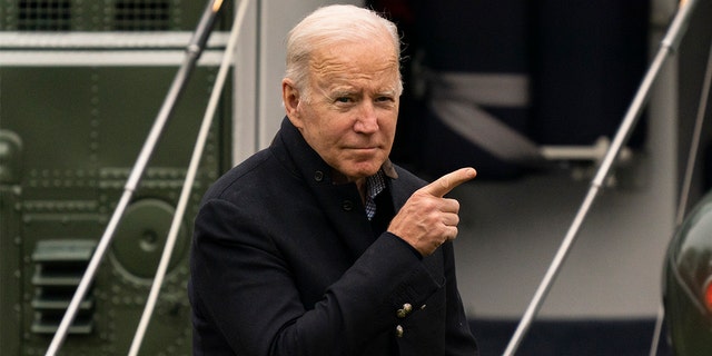 President Joe Biden standing outside Marine One.