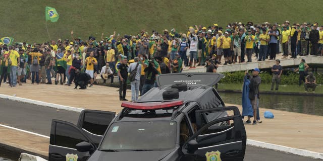 A view of damaged police car as supporters of former President Jair Bolsonaro clash with security forces after raiding the National Congress. (Joedson Alves/Anadolu Agency via Getty Images)