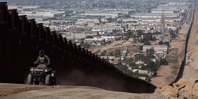 A border patrol agent patrols along a construction site for the secondary border fence which follows the length of the primary border fence that separates the United States and Mexico in the San Diego Sector on August 22, 2019 in San Diego, CA. 