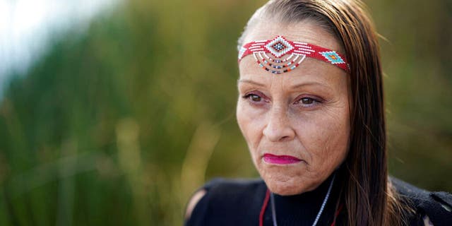 Moonlight Pulido poses for a portrait Wednesday, Dec. 7, 2022, in Los Angeles. California is paying reparations to victims, mostly women, who were either forcibly or coercively sterilized by the government. Pulido was sterilized while incarcerated in 2005.