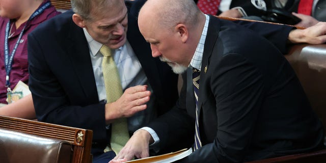 Rep.-elect Jim Jordan, R-Ohio, talks to Rep.-elect Chip Roy, R-Texas, in the House Chamber during the second day of elections for Speaker of the House at the U.S. Capitol Building on Jan. 4, 2023, in Washington, D.C. =