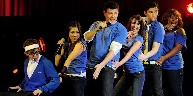 Cast members of "Glee," from left, Kevin McHale, Jenna Ushkowitz, Cory Monteith, Lea Michele, Chris Colfer and Amber Riley perform at The Gibson Amphitheater on May 20, 2010, in Universal City, California.