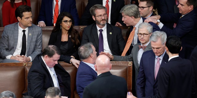 Rep.-elect Mike Rogers is restrained by Rep.-elect Richard Hudson, right, after getting into an argument with Rep.-elect Matt Gaetz during the election of a House speaker at the U.S. Capitol on Jan. 6, 2023.