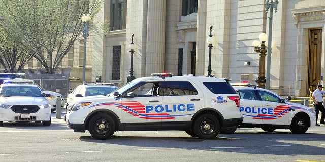 DC's Metropolitan Police Department vehicles close a street.