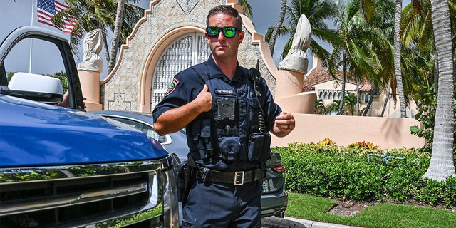 Local law enforcement officers are seen in front of the home of former President Trump at Mar-A-Lago in Palm Beach, Florida on Aug. 9, 2022.