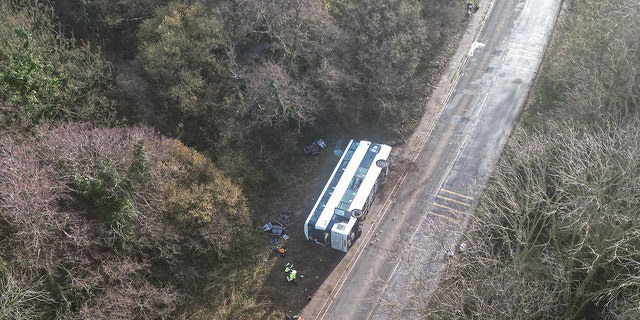 Emergency services work at the scene of a bus crash near Cannington, Britain, January 17, 2023. 