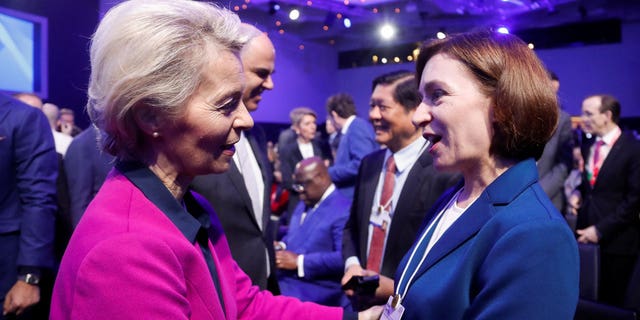 European Commission President Ursula von der Leyen (left) announced Europe's intentions to compete with American climate policy while addressing the Davos conference Tuesday.