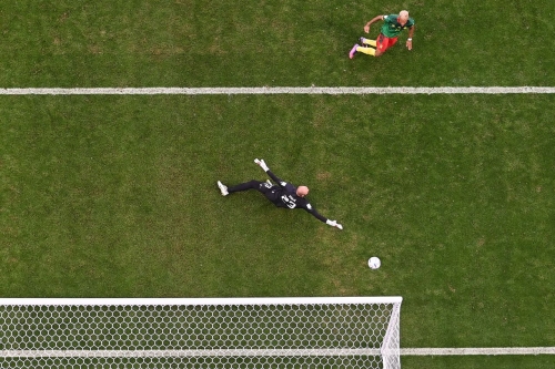 Cameroon forward Eric Maxim Choupo-Moting scores his team's third goal against Serbia, tying the match in the second half.