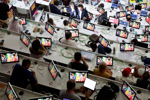 Media members work at Al Thumama Stadium in Doha for the Spain-Costa Rica match.