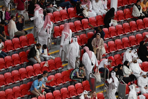 Spectators leave Al Bayt Stadium before the end of the Qatar-Ecuador match. No host country had lost a World Cup opener before.