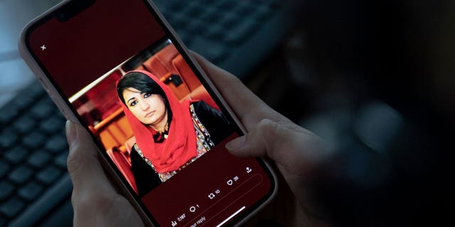 A picture of former Afghan lawmaker Mursal Nabizada on a mobile phone, who was shot dead by gunmen last night at her house in Kabul on Jan. 15, 2023.