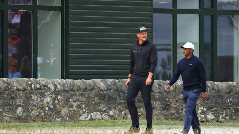 Meronk and Woods stroll past the St. Andrews Old Course Hotel.