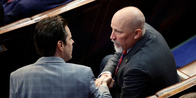 U.S. Rep.-elect Matt Gaetz (R-FL) (L) greets Rep.-elect Chip Roy (R-TX) in the House Chamber during the fourth day of elections for Speaker of the House at the U.S. Capitol Building on January 06, 2023 in Washington, DC.