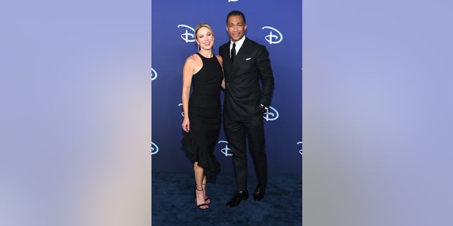 T.J. Holmes and Amy Robach smile on the red carpet together at the ABC Disney Upfront in May.