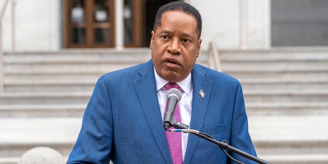 Conservative radio talk show host Larry Elder speaks to supporters during a campaign stop outside the Hall of Justice in downtown Los Angeles Sept. 2, 2021.