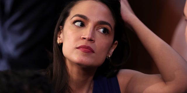 Rep. Alexandria Ocasio-Cortez, D-N.Y., waits as the House of Representatives holds the election for Speaker of the House, on the first day of the 118th Congress in the House Chamber of the U.S. Capitol Building on Jan. 3, 2023, in Washington, D.C. 