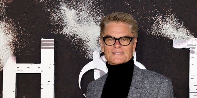 Harry Hamlin's college plans changed after he accepted a psychedelic drug from a Hell's Angel.