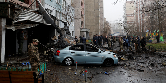 A view shows the site where a helicopter falls on civil infrastructure buildings in the town of Brovary, outside Kyiv, Ukraine.