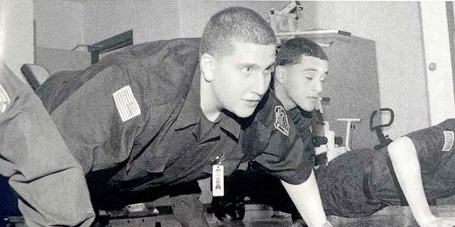 A yearhbook photo of Bryan Kohberger in a high school law enforcement class doing a push up. 