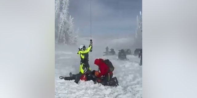 Rescuers hoisted the injured man to a hospital via helicopter.